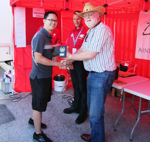 img_0933 Arthur Chan - London, overall winner of the National B Autosolo pictured being presented with his award by Club Steward, Paul Hiles with Clerk of Course, Nick Stafford behind.